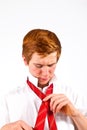 Teen boy knots his tie Royalty Free Stock Photo