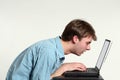 Teen boy looking very close at computer screen Royalty Free Stock Photo