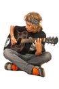 Teen boy playing acoustic guitar Royalty Free Stock Photo