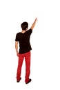Teen boy pointing at something. Rear view. Royalty Free Stock Photo