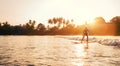 Teen boy silhouette riding a long surfboard. He caught a wave in an Indian ocean bay with magic sunset background. Extreme water Royalty Free Stock Photo