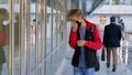 Teen boy student put on safety mask walking in school building. Portrait of schoolboy in protective mask enter campus Royalty Free Stock Photo