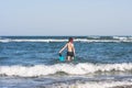 Teen boy in the swim flippers snorkeling mask and tude in the sea wave Royalty Free Stock Photo