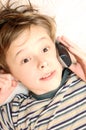 Teen boy talking on cell phone Royalty Free Stock Photo