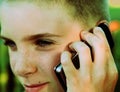 Teen boy talking on cell phone Royalty Free Stock Photo