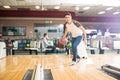 Teen Boy Throwing Ball While Practicing Bowling Game In Club Royalty Free Stock Photo