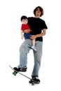 Teen Boy and Toddler Boy on Skateboard Royalty Free Stock Photo