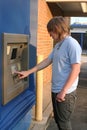 Teen Boy Using ATM