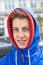 Teen boy wearing an anorak outside