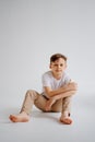 teen boy in white T-shirt pose in a photo studio. problems for teenage boys. Royalty Free Stock Photo