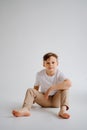 teen boy in white T-shirt pose in a photo studio. problems for teenage boys. Royalty Free Stock Photo