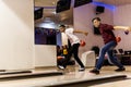 Teen boys bowling together at once