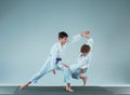 The two boys fighting at Aikido training in martial arts school. Healthy lifestyle and sports concept Royalty Free Stock Photo