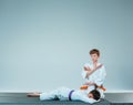 The two boys fighting at Aikido training in martial arts school. Healthy lifestyle and sports concept