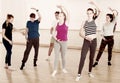 Teen boys and girls ballet dancers exercising