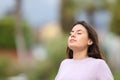 Teen breathing fresh air in a park