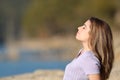 Teen breathing fresh air sitting in a lake