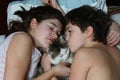 Teen brother and sister boy and girl cuddling cat Royalty Free Stock Photo
