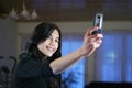 Teen with a camera phone Royalty Free Stock Photo