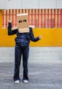 Teen with carton head mask