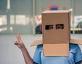 Teen with carton head mask Royalty Free Stock Photo