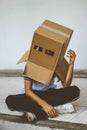 Teen with carton head mask Royalty Free Stock Photo