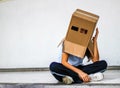 Teen with carton head mask Royalty Free Stock Photo