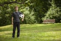 Teen child soccer player. Football Boy with ball on green grass Royalty Free Stock Photo