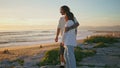 Teen couple enjoy sundown ocean. Young lovers hugging romantic summer vacation Royalty Free Stock Photo