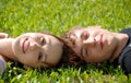 teen couple laying on the grass Royalty Free Stock Photo