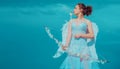 Teen cupid in white angels dress, valentine day with bow arrow shooting. Teenager angel with angels wings. Royalty Free Stock Photo