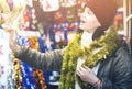 Teen customer near counter with Christmas gifts