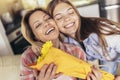 Daughter congratulates mom and gives her flowers Royalty Free Stock Photo