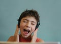 Teen dj boy listening to favourite rock group track singing along Royalty Free Stock Photo