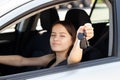 Teen driver, learning to drive and getting a driver`s license concept,teenager girl with keys at the wheel of a car Royalty Free Stock Photo