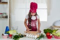 Teen eating healthy. wearing cook uniform. housekeeping and home helping. childhood development. small girl baking in