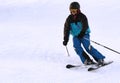 Teen enjoys competitive downhill skiing Royalty Free Stock Photo