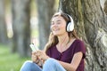 Teen feeling music on line outdoors