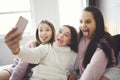 teen friends girls with smartphone taking selfie at home Royalty Free Stock Photo