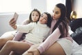 teen friends girls with smartphone taking selfie at home Royalty Free Stock Photo