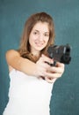 Teen girl aiming a gun