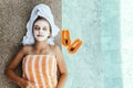 Teen girl applying organic fruit facial mask Royalty Free Stock Photo