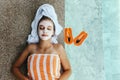 Teen girl applying organic fruit facial mask Royalty Free Stock Photo