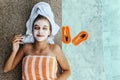 Teen girl applying organic fruit facial mask Royalty Free Stock Photo