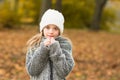 Teen girl in autumn nature withwhite hat. Autumn and fall concept with copy space Royalty Free Stock Photo