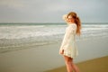 Teen girl at the beach smiling