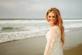 Teen girl at the beach by the waves Royalty Free Stock Photo