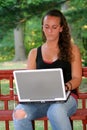Teen Girl Behind Laptop Outdoors Vertical Royalty Free Stock Photo
