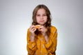 Teen girl biting and eating pizza, mouth full. Royalty Free Stock Photo