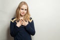 Teen girl in blue longsleeve on white background